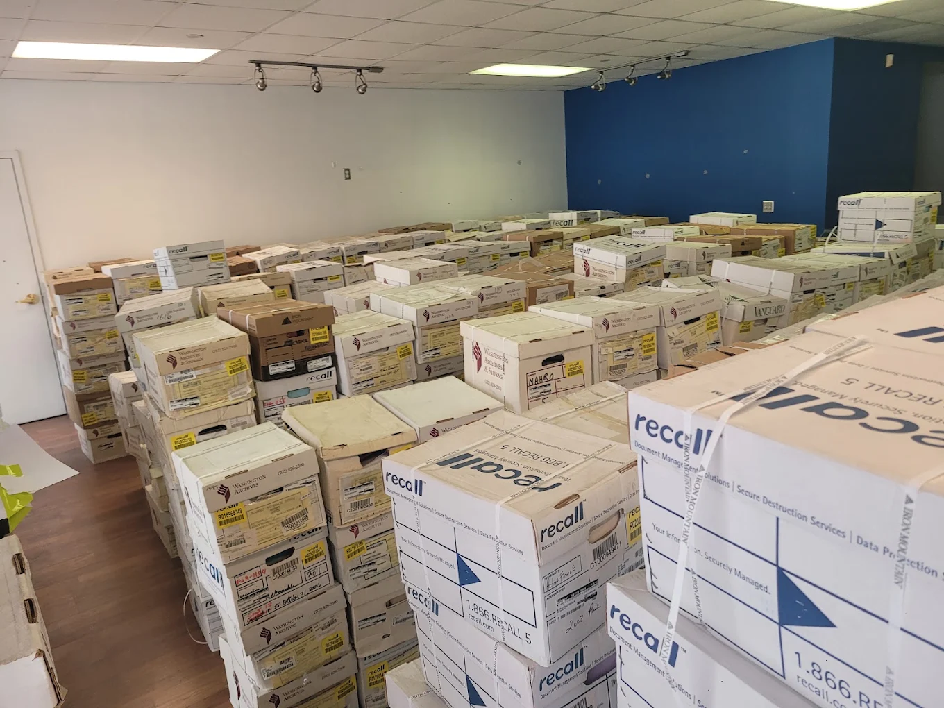 Commercial room packed floor to ceiling with hundreds of Recall archive record boxes