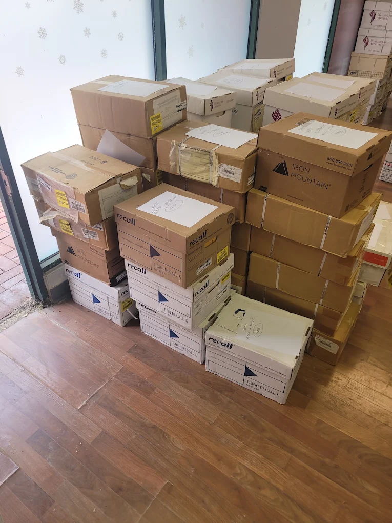 Stacks of archive and record storage boxes waiting for commercial removal