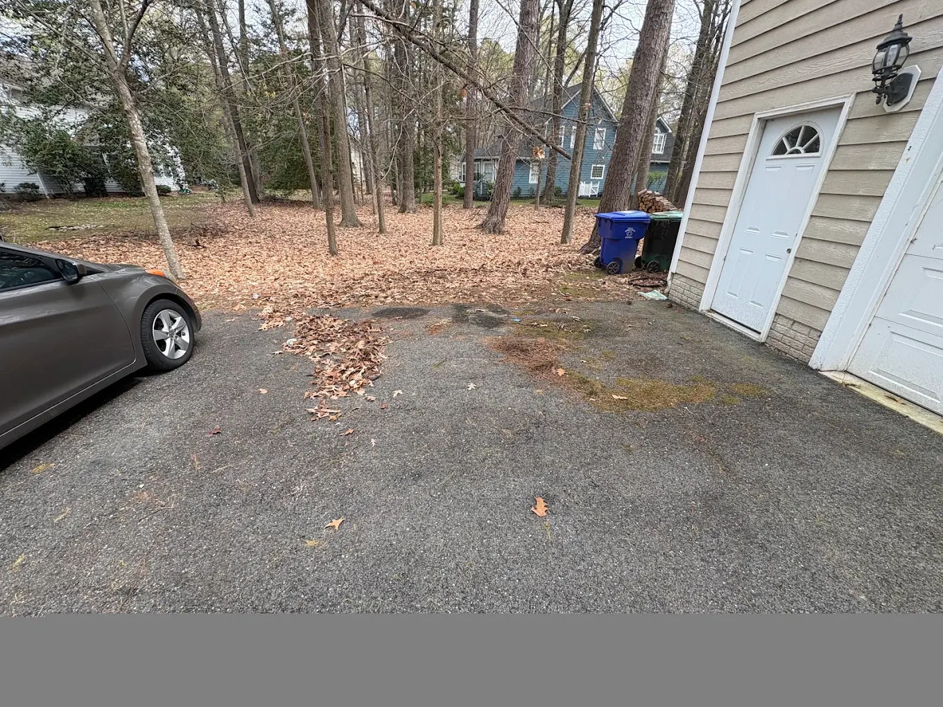 Empty, swept driveway after a Baten Hauling junk removal job